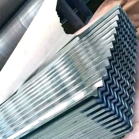Stack of galvanized steel studs with zigzag pattern held in hand
