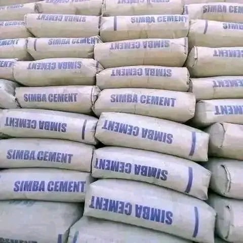 Stacked paper bags of Simba Cement with blue text labels printed on white and beige colored packaging
