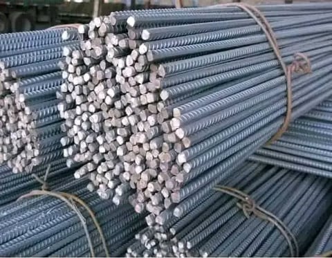 Stack of bundled steel reinforcement bars wrapped in wire straps