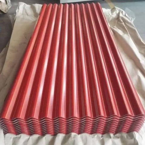 Red corrugated metal roofing sheet with wavy ridges wrapped in protective plastic packaging