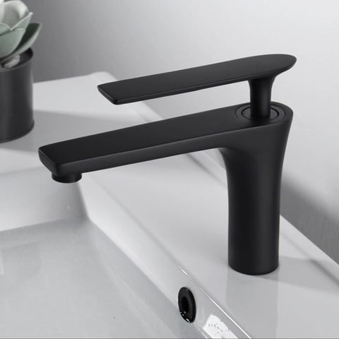 Modern black bathroom faucet with curved spout on white sink countertop